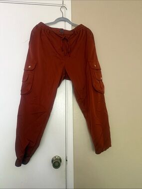 Clothing Brand Religion. Women's Cargo Joggers in Rust Red/Orange silk material